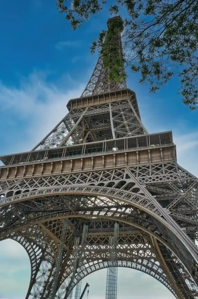 Iconic Eiffel Tower against blue Paris sky, symbol of French culture and language learning