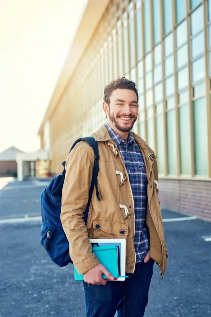 61765902 Happy University And Portrait Of Man With Books For Learning Education And Knowledge Outdoo 11zon