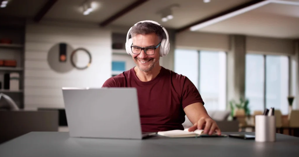 64582314 College Teacher At Home Using Laptop 11zon